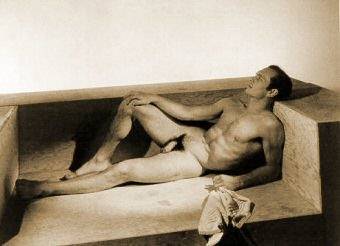 Yul Brynner on hard wooden sofa